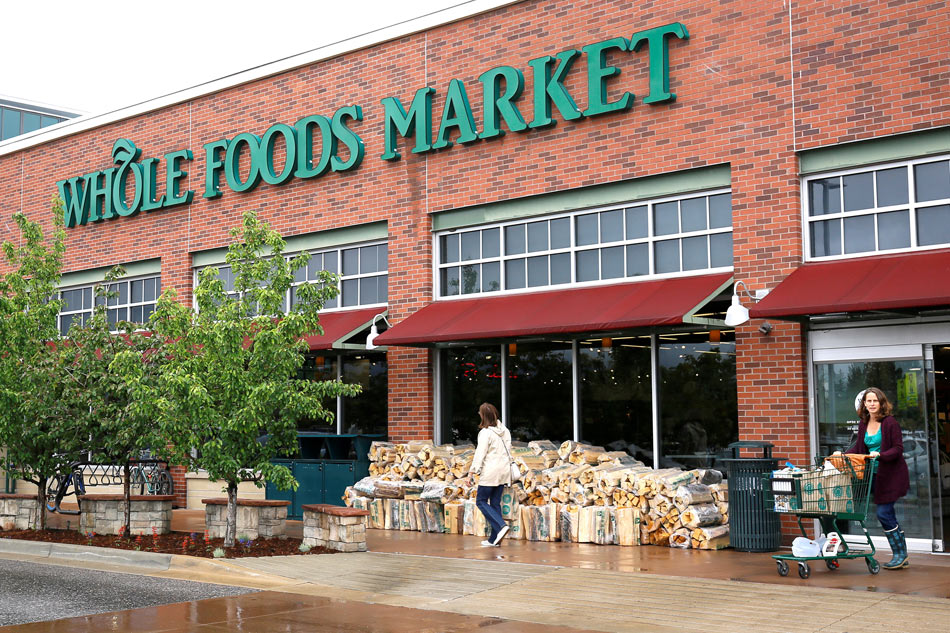 Customers leave the Whole Foods Market in Boulder Colorado US