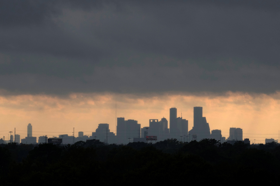 The Houston skyline is seen from the east as sunlight breaks through storm clouds from Tropical Storm Harvey in Texas U.S. Reuters