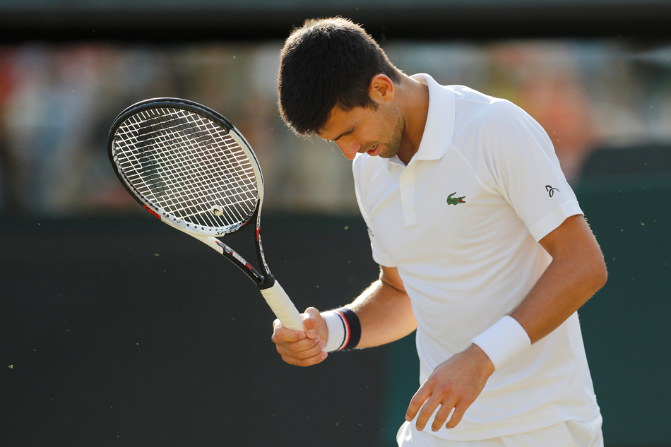 Djokovic wins under the roof at Wimbledon Djokovic wins under the roof at Wimbledon