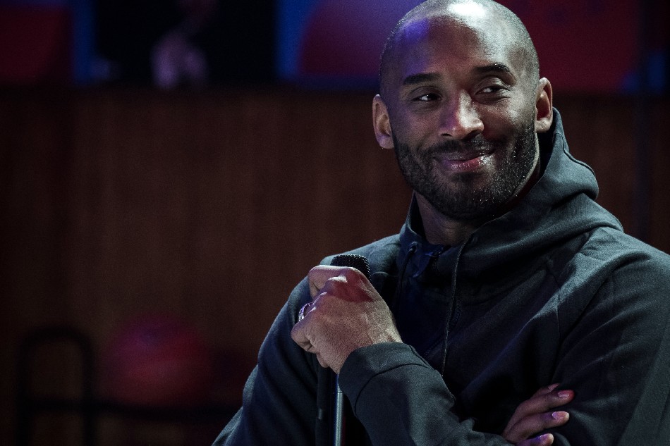 Former NBA basketball player Kobe Bryant attends a promotional event organized by the sports brand Nike, for the inauguration of the infrastructure improvements of a local basketball playground at the Jean-Jaures sports hall 