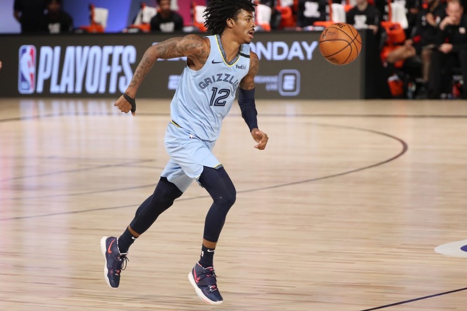 Ja Morant #12 of the Memphis Grizzlies handles the ball during the game against the Portland Trail Blazers during the Western Conference Play in Game on August 15, 2020 at The Field House at ESPN Wide World Of Sports Complex in Orlando, Florida. File photo. Joe Murphy, NBAE via Getty Images/AFP