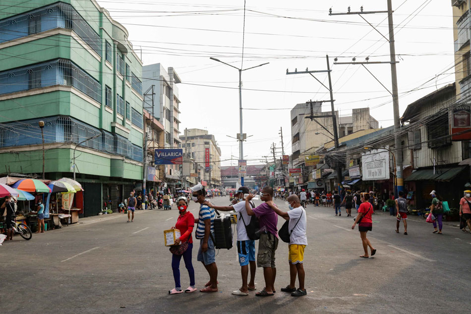The group pauses to check if they’ve covered each and every street of the Blumentritt Market in Sta. Cruz Manila. George Calvelo, ABS-CBN News