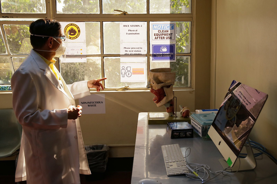 A medical professional at the Faculty of Medicine and Surgery at the University of Sto. Tomas on February 26, 2021. George Calvelo, ABS-CBN News/File