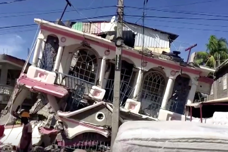 A view of a collapsed building following an earthquake, in Les Cayes, Haiti, in this still image taken from a video obtained by Reuters on August 14, 2021. Reuters TV via Reuters
