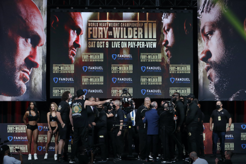 Tyson Fury and Deontay Wilder during their official weigh-in. Steve Marcus, Reuters