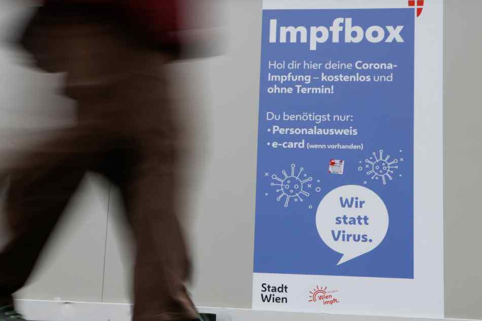 A man walks past a vaccination point amidst the coronavirus disease (COVID-19) outbreak, as Austria