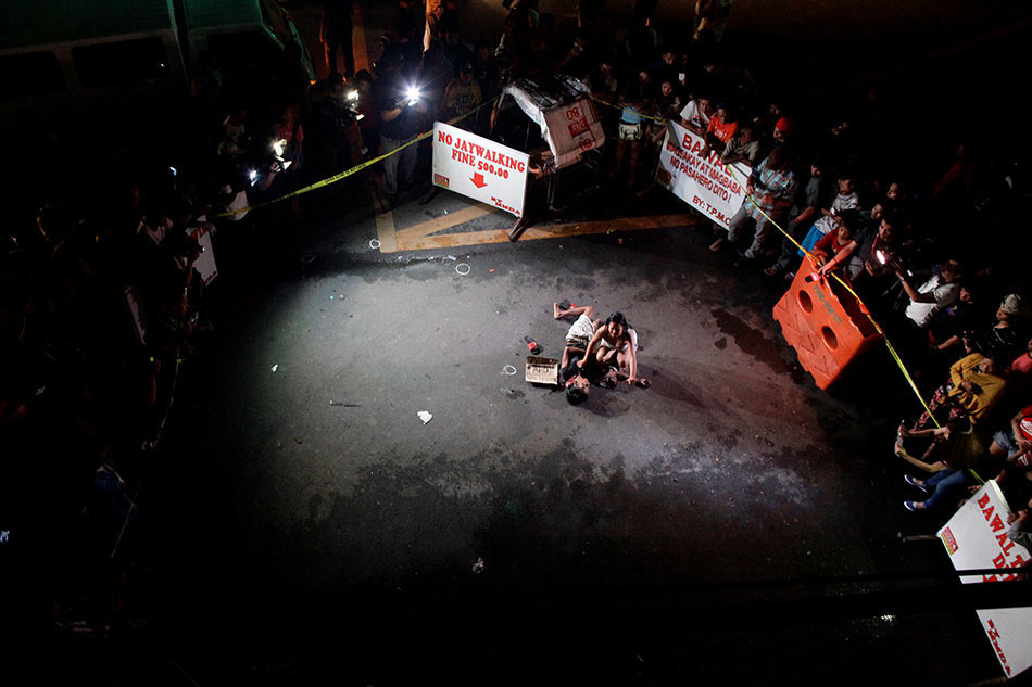 A woman weeps over the body of her husband, who was killed on a street by a vigilante group, according to police, in a spate of drug-related killings in Pasay City. Czar Dancel, Reuters/file