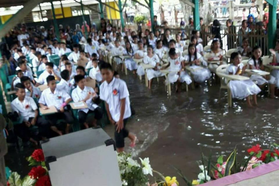LOOK: Students brave Basilan flood to attend swamped graduation 3