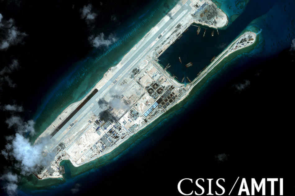 China unveils monument to South China Sea island building 1
