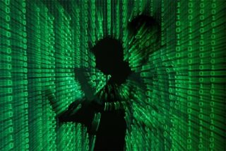Hackers' broad attack sets cyber experts worldwide scrambling to defend networks