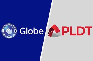 Telco shares surge anew, a stock market trades flat 