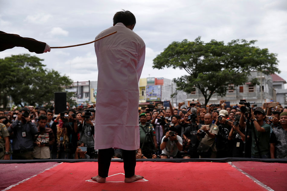 Indonesian Men Caned For Gay Sex Before Jeering Crowd Abs Cbn News