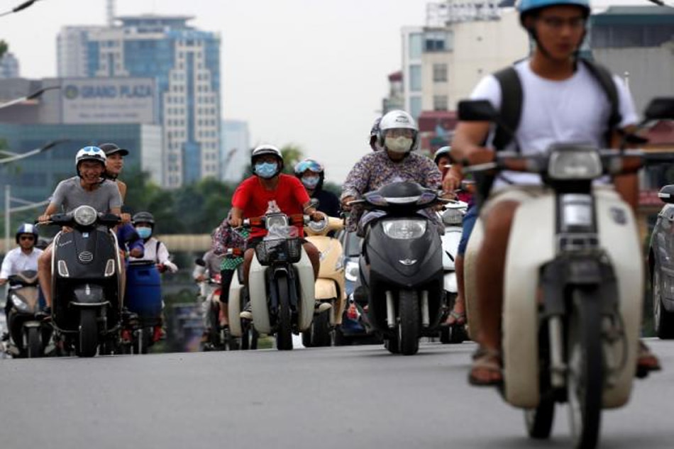  Vietnam  city to ban  motorbikes  to curb pollution traffic 