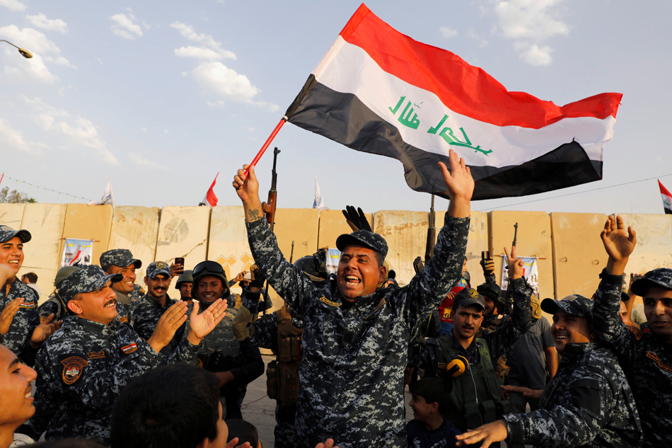 Iraqi Pm Declares End Of War Against Is In Iraq Abs Cbn News File Photo A Member Of Iraqi Federal Police Waves An Flag As They Celebrate Victory Military Operations Against The Ic State Militants In