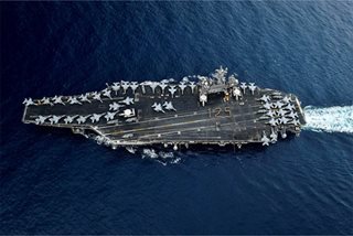 New COVID-19 cases on US carrier despite extensive screening