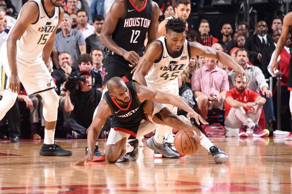 Jazz's Donovan Mitchell helped off court in Houston