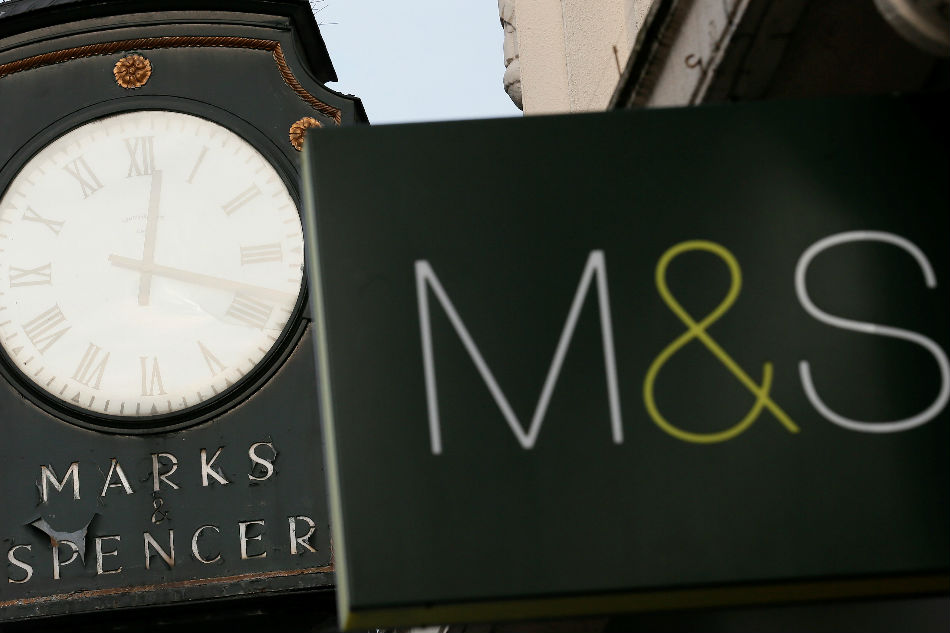 Marks & Spencer signs are seen outside outside a store in London Britain