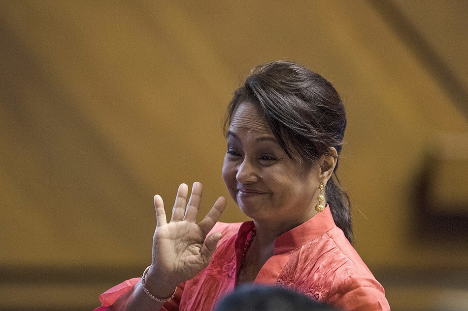 Former Philippine president and congresswoman Gloria Arroyo waves during the third session of the 17th Congress ahead of Philippine President Rodrigo Duterte's state of the nation address at Congress, in Manila on July 23, 2018. Noel Celis, AFP/file