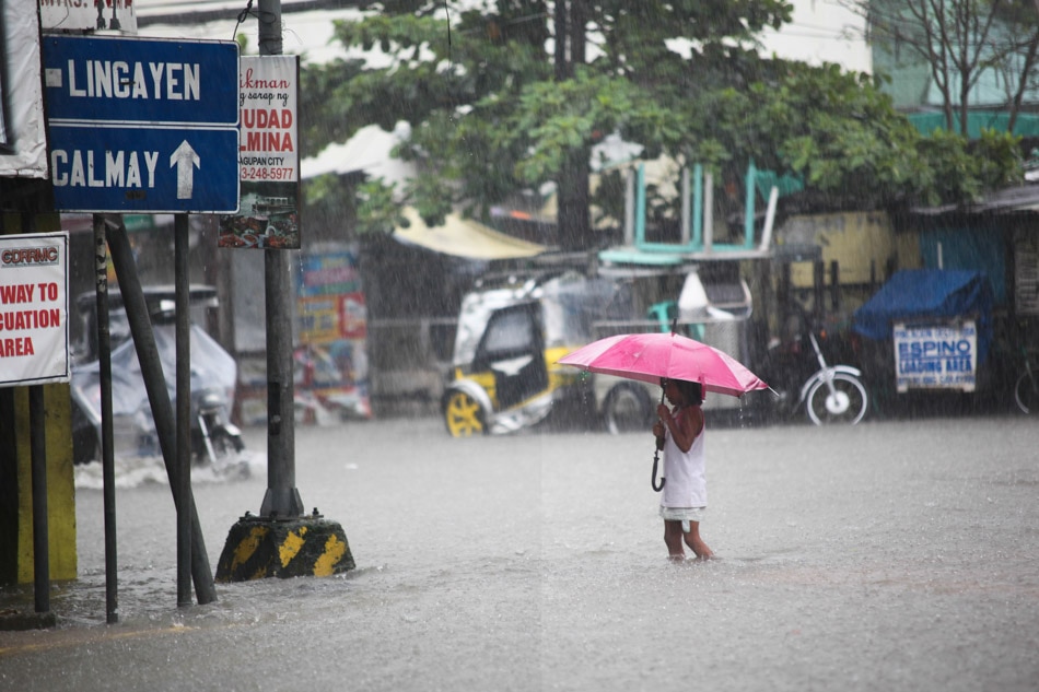 Braving the flood and rain | ABS-CBN News