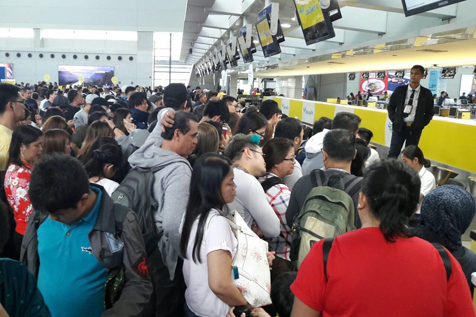 LOOK: Passengers cramped in NAIA due to canceled flights | ABS-CBN News