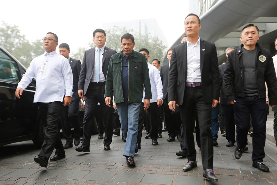 President Rodrigo Duterte, accompanied by businessman Michael Yang (2nd from right) and members of his delegation and Chinese officials, in Beijing, China on October 19, 2016. 