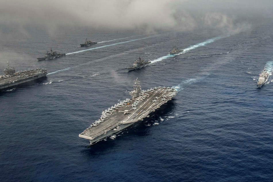 The Nimitz-class aircraft carriers USS John C. Stennis (CVN 74) and USS Ronald Reagan (CVN 76) conduct dual aircraft carrier strike group operations in the U.S. 7th Fleet area of operations. US Navy photo/file