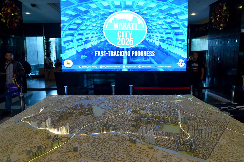Guests check the scale model of Makati City with the proposed route of the Makati Subway Project unveiled at the Makati City Hall. The 10km railway from EDSA-Ayala to the University of Makati, which traverses several commercial centers and important locations, is scheduled to be completed in 2025. George Calvelo, ABS-CBN News