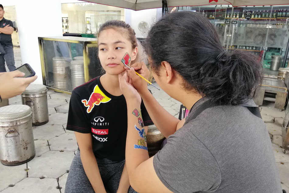 School pride for Ateneo, UP fans with face paint ahead of UAAP finals ...