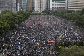 Hong Kong protesters rally to show 'peaceful' credentials after chaos