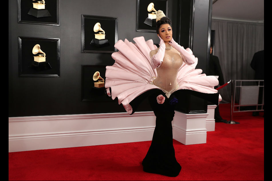 Cardi B steals Grammys red carpet preshow with oysters and pearls