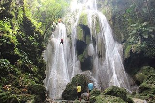 Rainy season travel idea: Try waterfalls rappelling