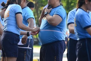 Philippine police win battle of the bulge after body fat rule dropped