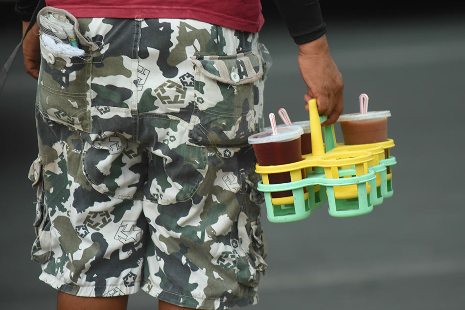 Various sweetened drinks are carried in a tray inside a market in Pasig City on June 15, 2017. George Calvelo, ABS-CBN News/File