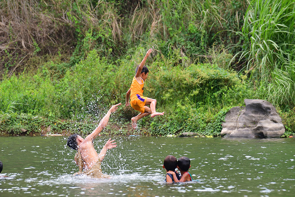Visitors cool off from the summer heat along the Marikina River in Rodriguez, Rizal on May 21, 2018. Mark Demayo, ABS-CBN News/file