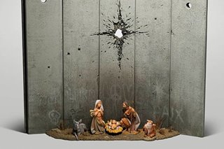 LOOK: Mysterious artist Banksy unveils dark nativity in Bethlehem