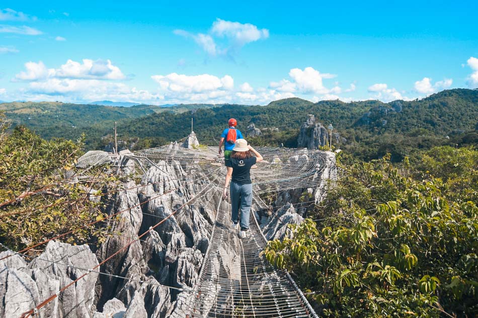 Park rangers show visitors the landscape in Baras, Rizal from the “Sapot” at the Masungi Georeserve on October 24, 2019. The conservation area was recently recognized for its sustainable tourism practices at the UN World Tourism Organization Awards last September. Mark Demayo, ABS-CBN News