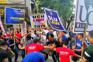 Schoolmates cheer, dance for Bar takers on last exam day