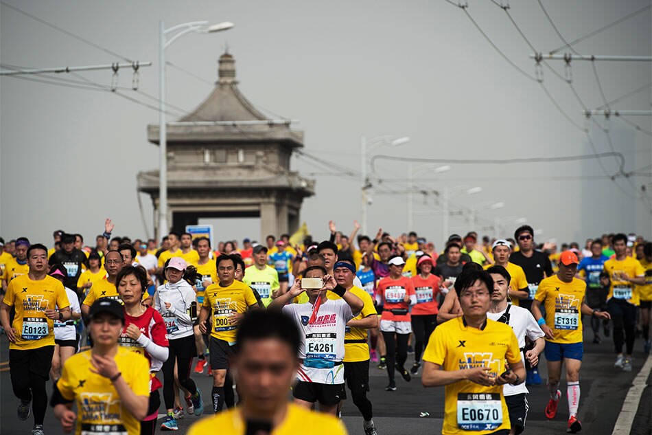 Bikes, shortcuts, bibs for cash China marathon cheats run rampant