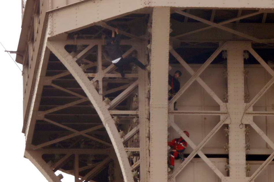 Eiffel Tower evacuated after climber scales monument 1