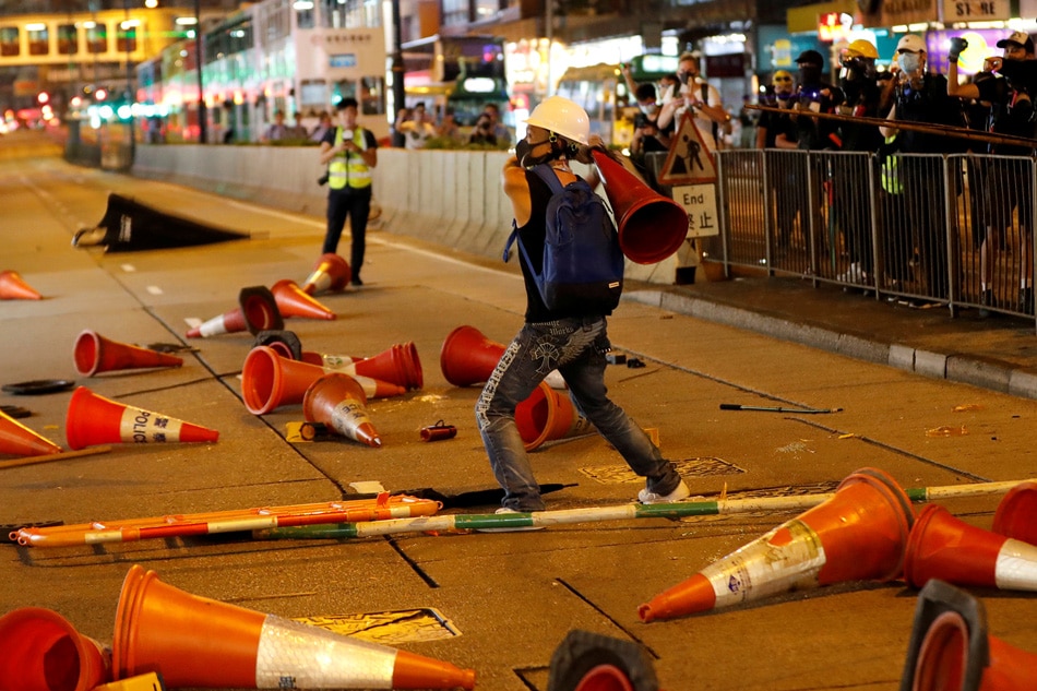 Hong Kongers harness traffic cones, kitchenware to battle ...