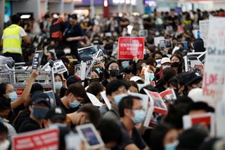 Stranded passengers voice support for Hong Kong protesters