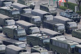 Chinese military personnel parade near Hong Kong border: report