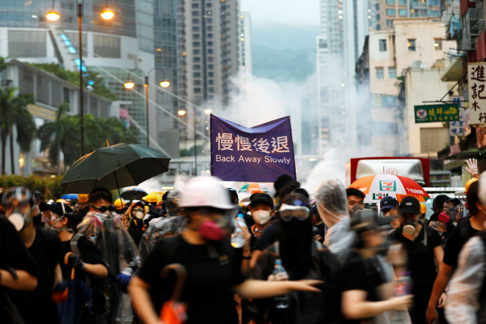 Hong Kong police arrest 36, youngest aged 12, after running battles with protesters 1