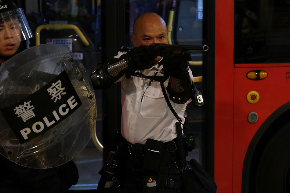 Clashes In Hong Kong After Police Charge Protesters With Rioting | ABS ...