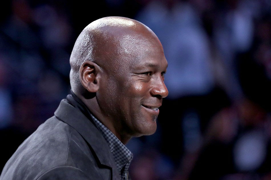 Michael Jordan, owner of the Charlotte Hornets, takes part in a ceremony honoring the 2020 NBA All-Star game during a break in play as Team LeBron take on Team Giannis in the fourth quarter during the NBA All-Star game as part of the 2019 NBA All-Star Weekend at Spectrum Center on February 17, 2019 in Charlotte, North Carolina. File photo. Streeter Lecka, Getty Images/AFP