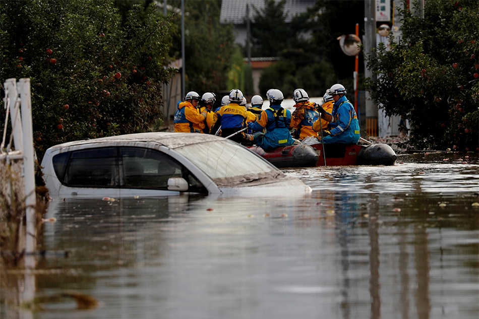 Japan Rescuers Wade In Muddy Waters To Find Typhoon Survivors | ABS-CBN ...