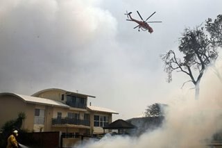 2 dead, at least 100 homes lost in Australia bushfires