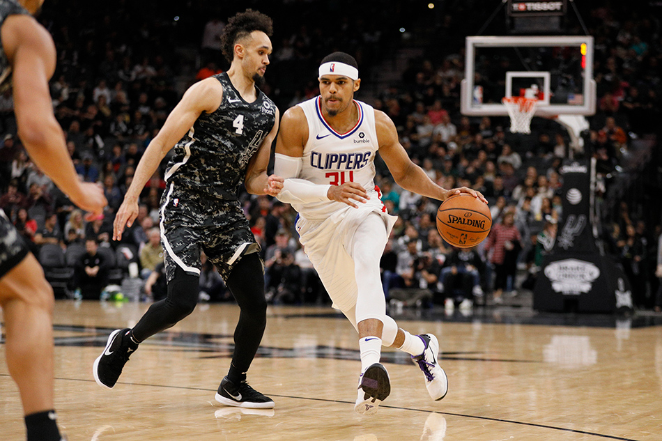 Tobias Harris and Boban Marjanovic of the LA Clippers exchange