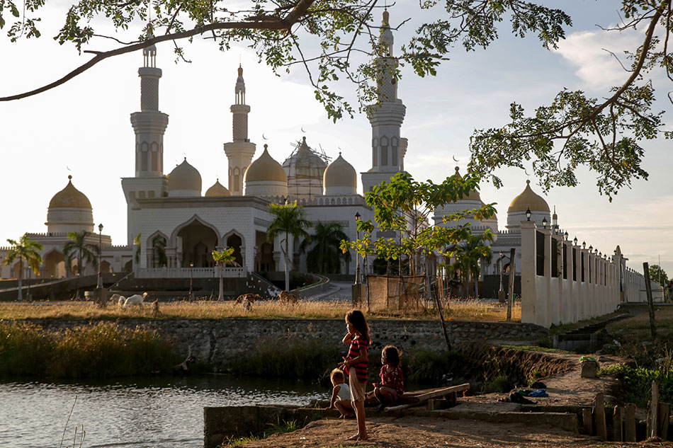 Children enjoy playing by a river near the Grand Mosque in Cotabato City, January 24, 2019. Jonathan Cellona, ABS-CBN News/File