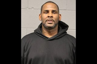 R. Kelly’s associates charged with threatening his accusers